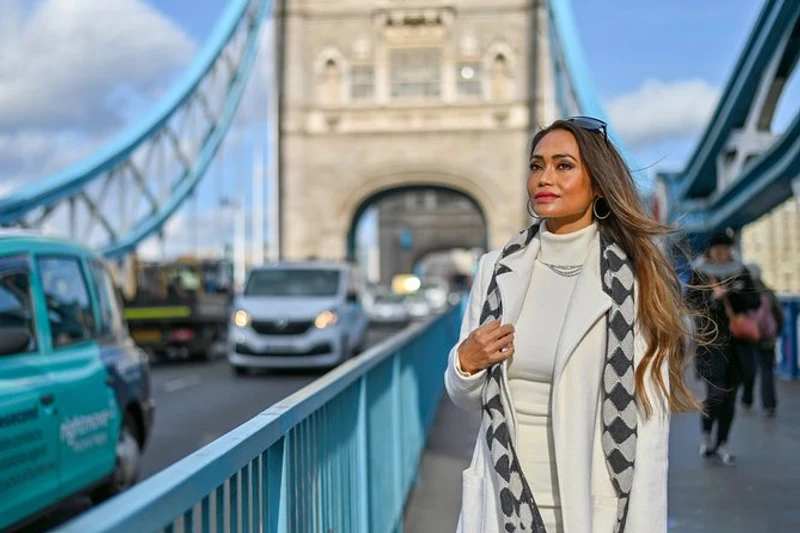 Traveller photographed on Tower Bridge walkway during a London landmarks photoshoot