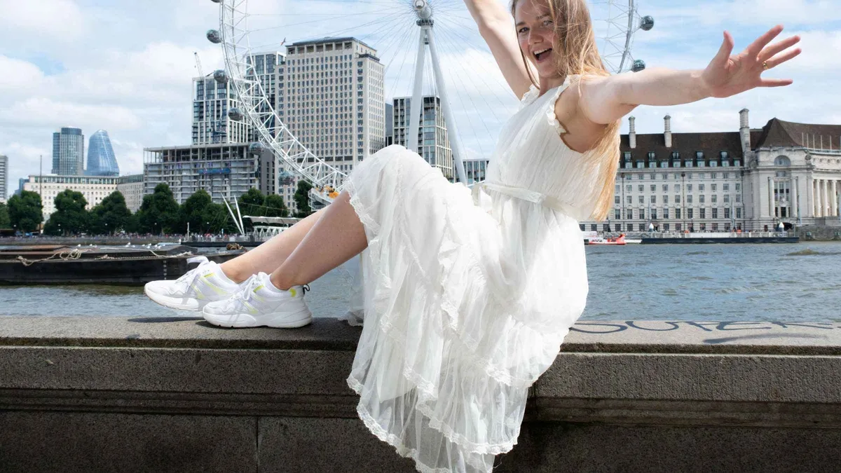 Couple posing beside Westminster Bridge during a private London landmark photoshoot