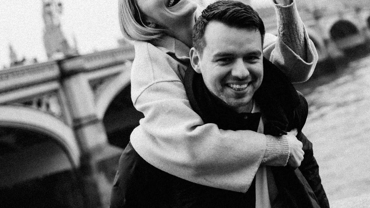 Couple photographed at sunset by Westminster Bridge during a romantic London photoshoot